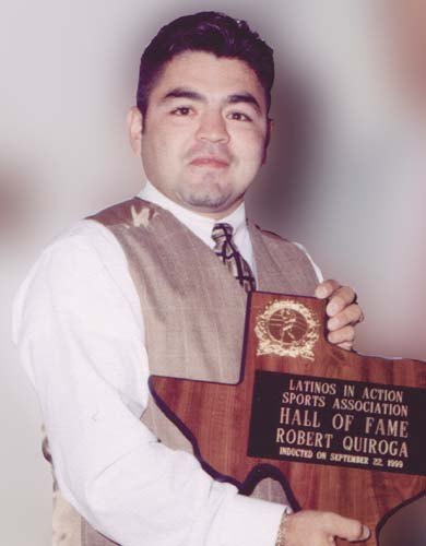 Robert Quiroga holding a Hall of Fame plaque